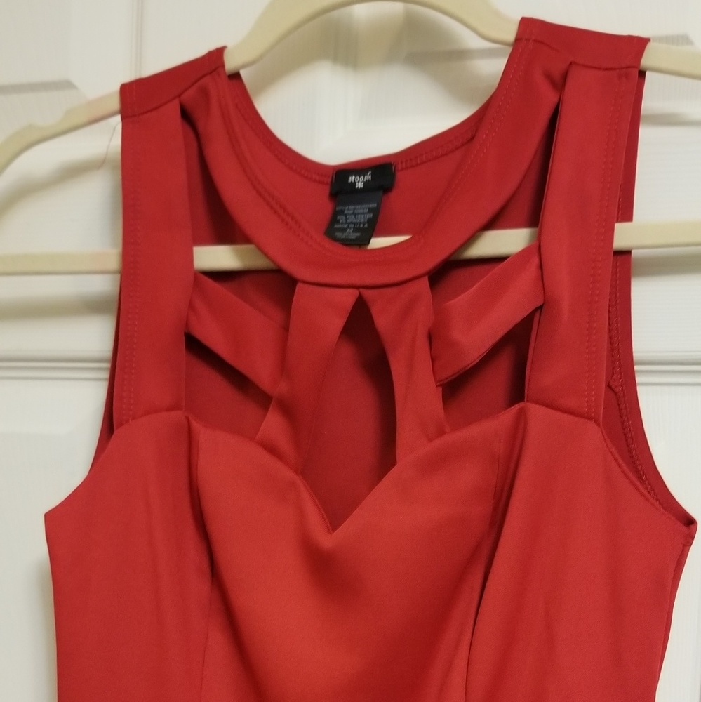 Red sleeveless summer shirt with cutout detail in